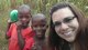 AFCEC European Store Front Program Manager April Whitbeck poses for a selfie with children from a Ugandan village. Whitbeck, and other members of the Ramstein Air Base, Germany, Society of American Military Engineers chapter, travel to Uganda to deliver disinfected water to the local villagers. (Coutesy photo/April Whitbeck)