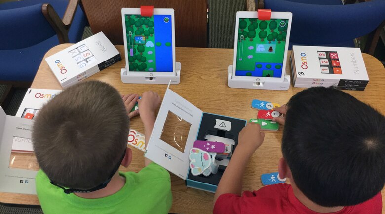 Makerspace kids use OSMO coding, a program that runs alongside an iPad app to teach the basics of coding.