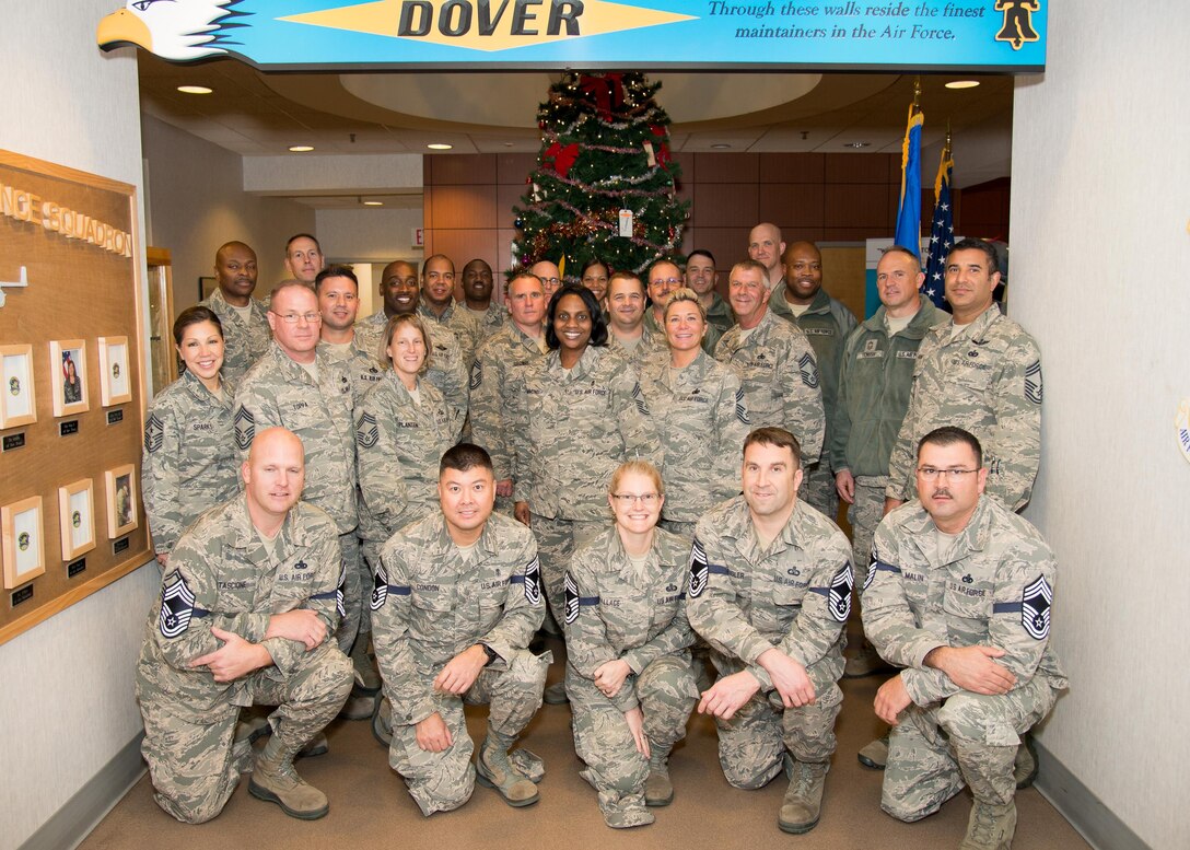 Team Dover chief master sergeants pose with senior master sergeants selected for promotion Dec. 7, 2016, on Dover Air Force Base, Del.  Team Dover had seven senior master sergeants selected for promotion. Kneeling from left to right are Senior Master Sgt. Peter Tascione, 436th Aircraft Maintenance Squadron; Senior Master Sgt. William Condon, 436th Aerospace Medicine Squadron; Senior Master Sgt. Tracy Wallace, 436th Force Support Squadron; Senior Master Sgt. Chad Ziegler, 436th Operations Support Squadron; Senior Master Sgt. Chadd Malin, 736th Aircraft Maintenance Squadron. Not pictured: Senior Master Sgt. David Hitchens, Air Force Mortuary Affairs and Senior Master Sgt. David Miller, inbound from Altus Air Force Base. (U.S. Air Force photo by Mauricio Campino)