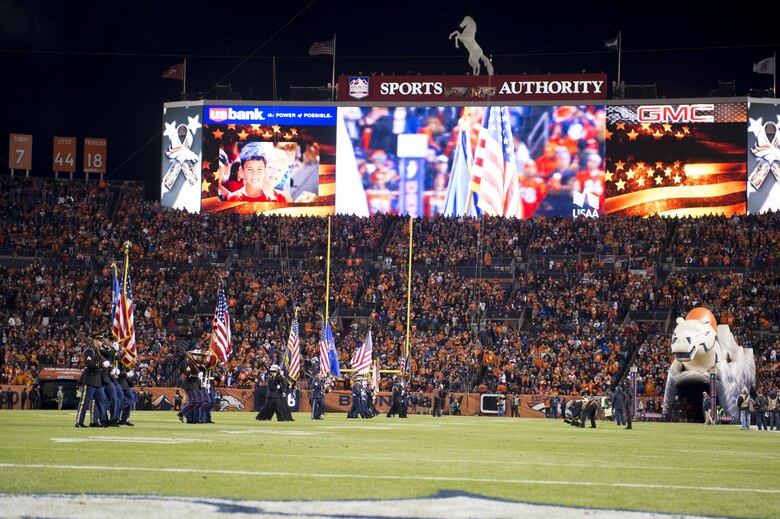 DENVER – Members of the U.S. Armed Forces Honor Guard present the American flag along with their respective service flag during the Salute to Service football game between the Denver Broncos and the Kansas City Chiefs, Nov. 27, 2016, at Sports Authority Field at Mile High in Denver. During the game, U.S. Army Lt. Gen. Reynold Hoover, U.S. Northern Command deputy commander, presented the head referee with the coin used in the opening coin toss and met with several Vietnam veterans in attendance. (U.S. Air Force photo by Senior Master Sgt. Chuck Marsh/Released)