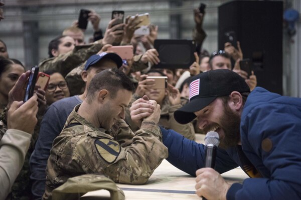 Scarlett Johansson and Chris Evans perform for service members during the USO Holiday Tour at Bagram Air Base, Afghanistan, Dec. 7, 2016. Marine Gen. Joseph F. Dunford, Jr., chairman of the Joint Chiefs of Staff, along with USO entertainers, visited service members who are deployed from home during the holidays at various locations across the globe.  This year’s entertainers included actors Chris Evans, actress Scarlett Johansson, NBA Legend Ray Allen, 4-time Olympic Medalist Maya DiRado, Country Music Singer Craig Campbell, and mentalist Jim Karol. (DoD photo by Navy Petty Officer 2nd Class Dominique A. Pineiro/Released)