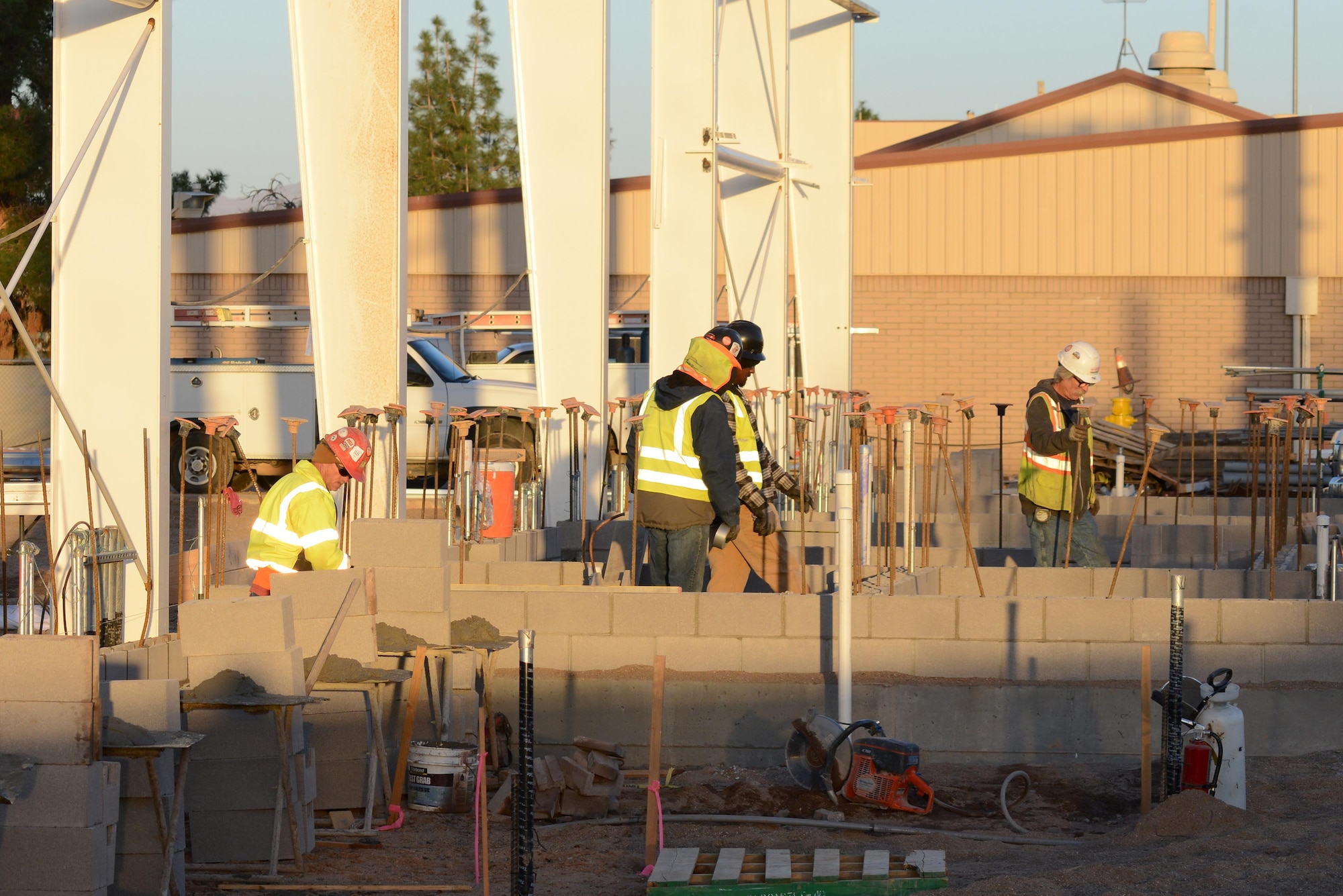 A 56th Civil Engineering Squadron general contractors work on building the offices and communication room portion of the 62nd Fighter Squadron hangar Dec. 8, 2016, at Luke Air Force Base, Ariz. The building will also house a fire protection room and restrooms. (U.S. Air Force photo by Airman 1st Class Pedro Mota)