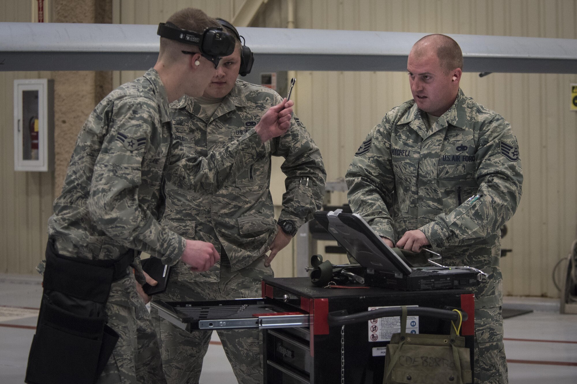 Air Commandos with the 27th Special Operations Maintenance Squadron rush to complete their tasking for a weapons load competition Dec. 2, 2016, at Cannon Air Force Base, N.M. The competition tests weapons load crews’ proficiency, reliability and speed. (U.S. Air Force Photo by Senior Airman Shelby Kay-Fantozzi/released) 