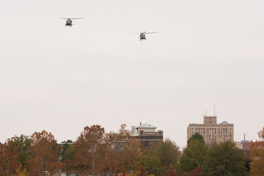 Two UH-60 Black Hawk helicopters from the Arkansas National Guard, Camp Robinson, Ark., cross the Arkansas River during a flyover of the “Arkansas Remembers Pearl Harbor Ceremony” at the Arkansas Inland Maritime Museum in North Little Rock, Ark., Dec. 7, 2016. The ceremony commemorated the 75th Anniversary of the attack on Pearl Harbor. (U.S. Air Force photo by Master Sgt. Jeff Walston/Released)