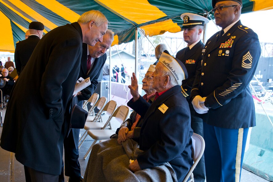 Arkansas Governor William Asa Hutchinson II, (Left) and North Little Rock’s Mayor Joe Smith, speak with Pearl Harbor Survivors William M. Chase and Walter Smith, during the “Arkansas Remembers Pearl Harbor Ceremony” commemorating the 75th Anniversary of the attack on Pearl Harbor, at the Arkansas Inland Maritime Museum in North Little Rock, Ark., Dec. 7, 2016. The ceremony was filled with veterans, civilians and local politicians all brought together to remember and recognize the sacrifice of so many. (U.S. Air Force photo by Master Sgt. Jeff Walston/Released)