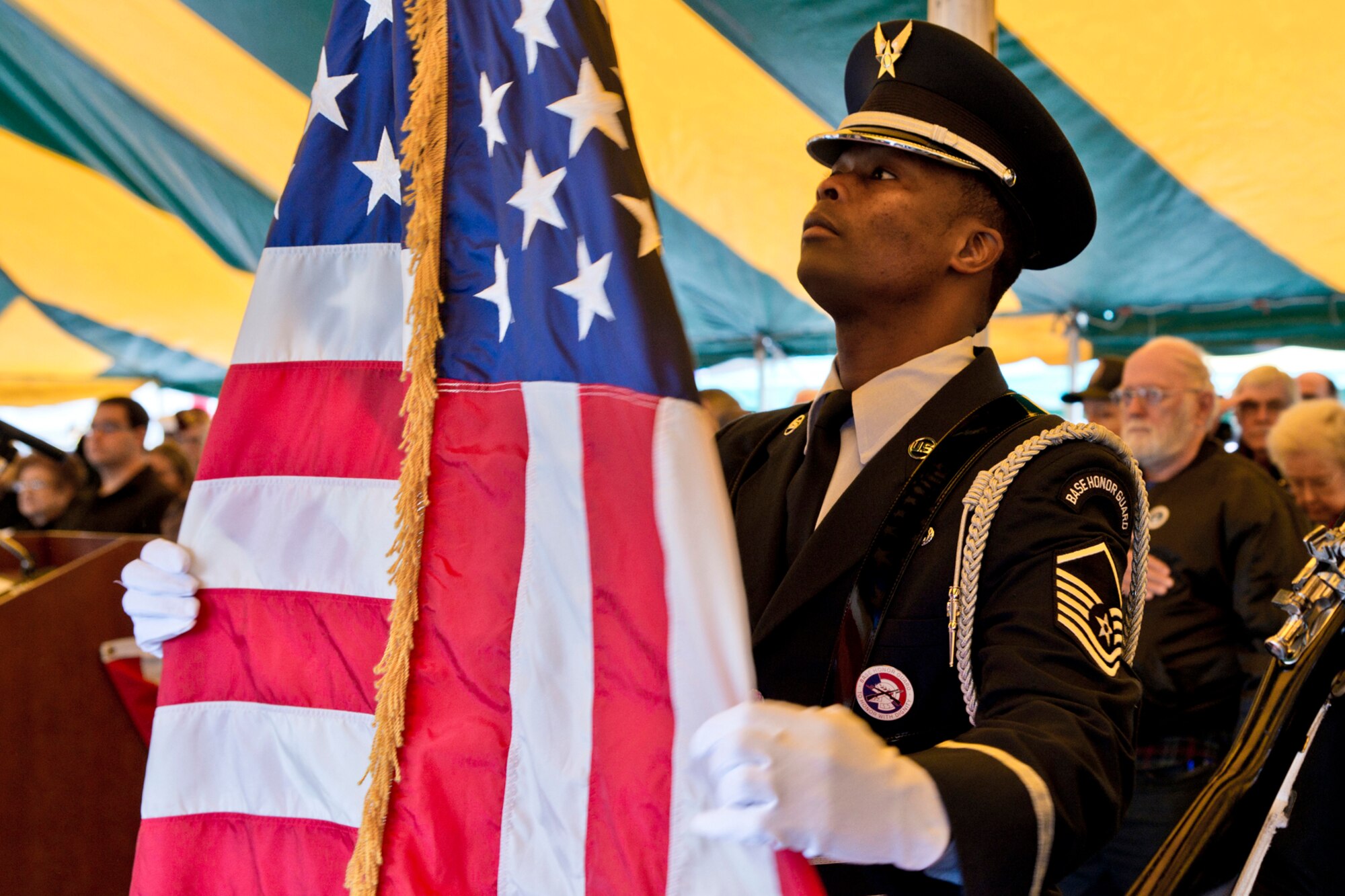 Arkansas Air National Guard Master Sgt. Kente Reed, aircraft flight equipment superintendent, 189th Operations Support Squadron, posts the colors with an Armed Services Joint Color Guard, during the “Arkansas Remembers Pearl Harbor Ceremony” at the Arkansas Inland Maritime Museum in North Little Rock, Ark., Dec. 7, 2016. The ceremony was filled with veterans, civilians and local politicians, all coming together to remember and recognize those of the “Greatest Generation,” who sacrificed so much. (U.S. Air Force photo by Master Sgt. Jeff Walston/Released)