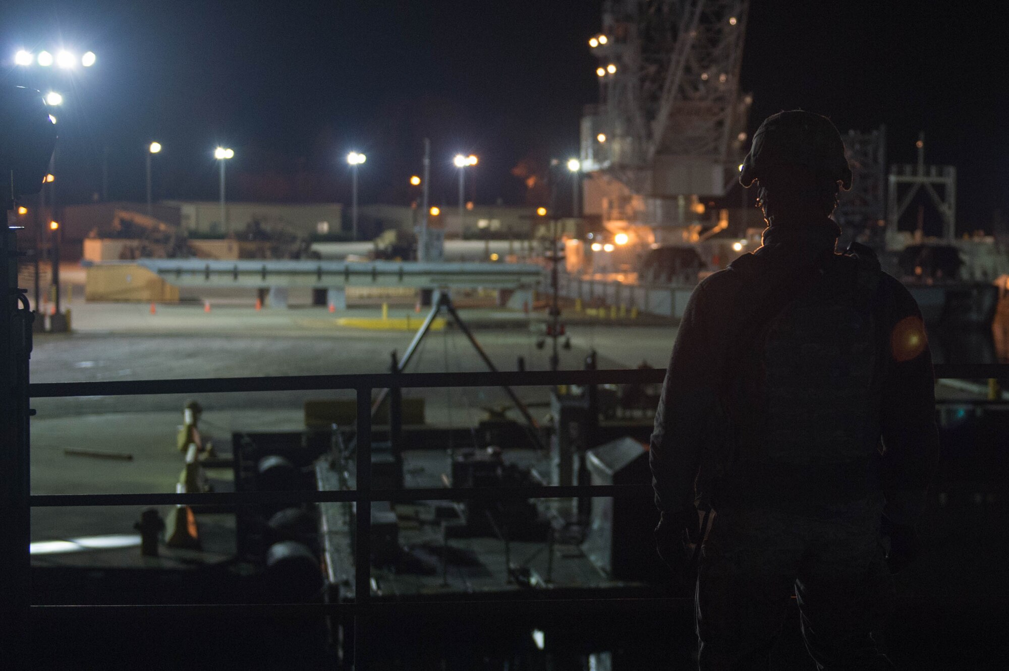U.S Air Force Senior Airman Jabai Robinson, 633rd Security Forces Squadron response force leader, keeps watch during exercise Operation Resolute Endeavor II at Joint Base Langley-Eustis, Va., Dec. 7, 2016. Airmen from the 633rd SFS were tasked with an initial waterborne infiltration and secure mission on the first day of the exercise, then maintained security by eliminating threats that attempted to gain access to Third Port. (U.S. Air Force photo by Airman 1st Class Derek Seifert)