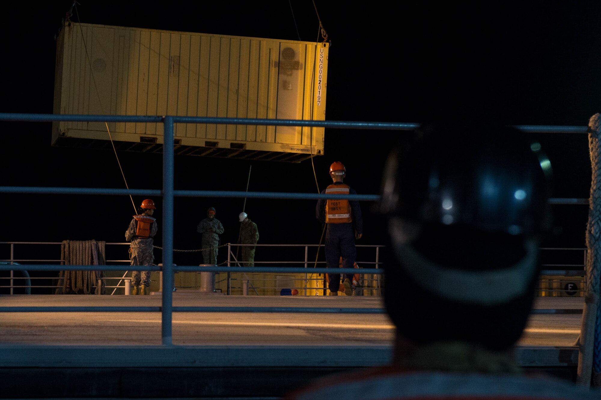U.S. Army Soldiers and U.S. Navy Sailors unload cargo during exercise Operation Resolute Endeavor II at Joint Base Langley-Eustis, Dec. 7, 2016. The exercise utilized each service’s abilities to ensure operations could continue, by safely transporting cargo across waterways, unloading and securing the cargo and securing and patrolling Third Port. (U.S. Air Force photo by Airman 1st Class Derek Seifert)