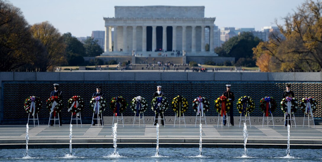 Honor guards from each branch of the military guard the wreaths during the 2016 Pearl Harbor Remembrance Day 75th Anniversary Commemoration at the World War II Memorial in Washington, D.C., Dec. 7, 2016. (U.S. Army photo/Sgt. Jose A. Torres Jr.)