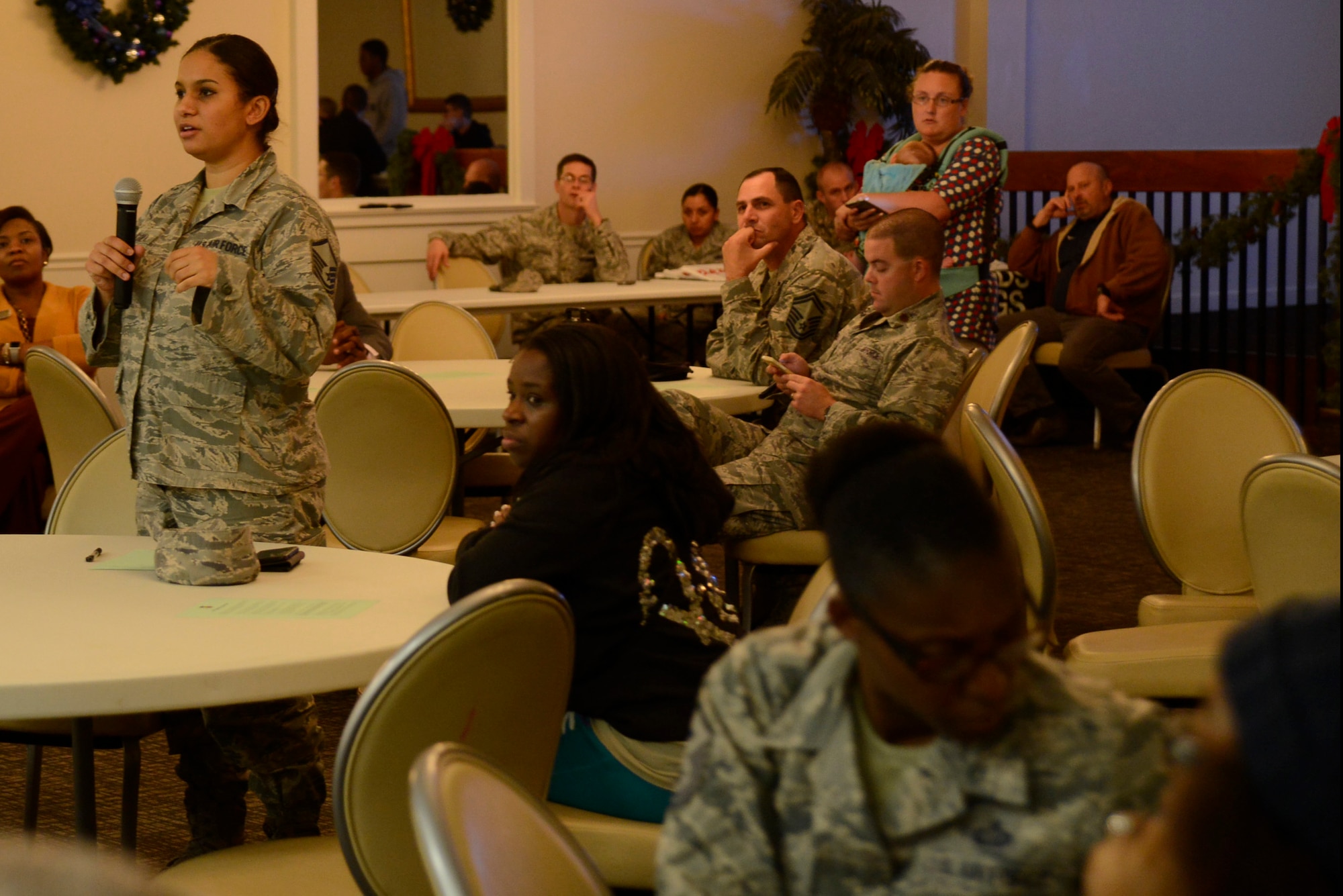 A Team Shaw member asks a question during the 20th Fighter Wing Town Hall meeting at Shaw Air Force Base, S.C., Nov. 29, 2016. Town hall meetings give Team Shaw members the opportunity to voice concerns directly to Shaw leaders. (U.S. Air Force photo by Airman 1st Class BrieAnna Stillman)