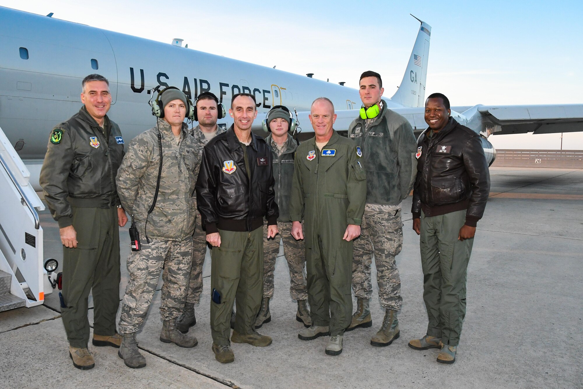 U.S. Air Force Maj. Gen. Scott J. Zobrist, 9th Air Force commander, and Chief Master Sgt. Frank H. Batten III, 9th AF command chief, visit with the Joint Surveillance Target Attack Radar System, or JSTARS, team at Robins Air Force Base, Ga., to learn more about its mission and capabilities, Dec. 8, 2016.  During the visit, Zobrist and Batten met with Team JSTARS leadership and Airmen and flew a mission aboard the E-8C Joint STARS, manned airborne battle management, command and control, intelligence, surveillance and reconnaissance platform. (U.S. Air National Guard photo by Senior Master Sgt. Roger Parsons) (Portion of aircraft maintainer's ear defender blurred for security purposes)