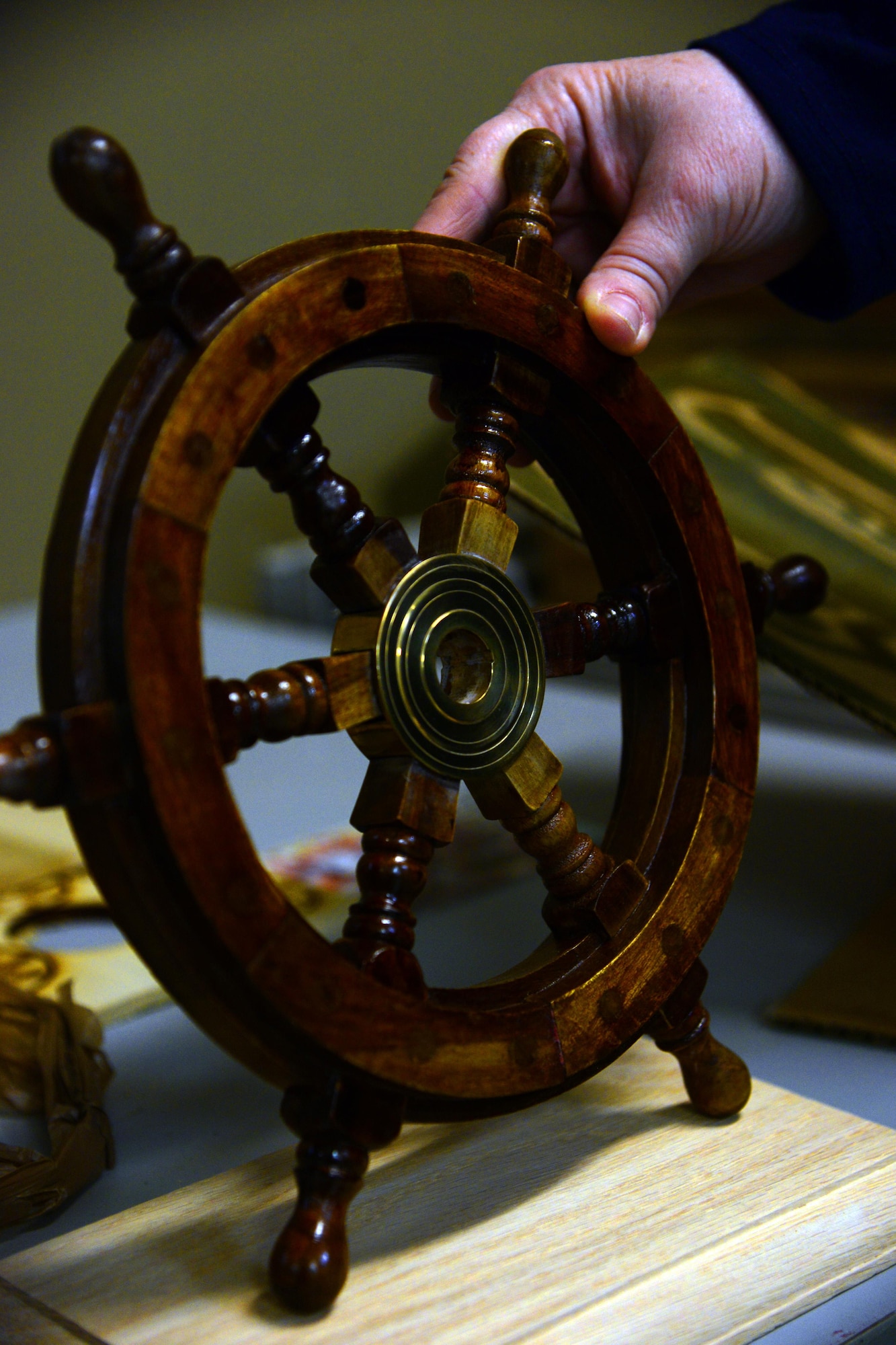 The Engraving Shop located in the Arts and Crafts Center at Malmstrom Air Force Base, Mont., not only specializes in engraving but also makes the majority of their projects from scratch. A wooden ship’s wheel was carved by the shop’s woodworker Dec. 7, 2016. (U.S. Air Force photo/Airman 1st Class Magen M. Reeves)