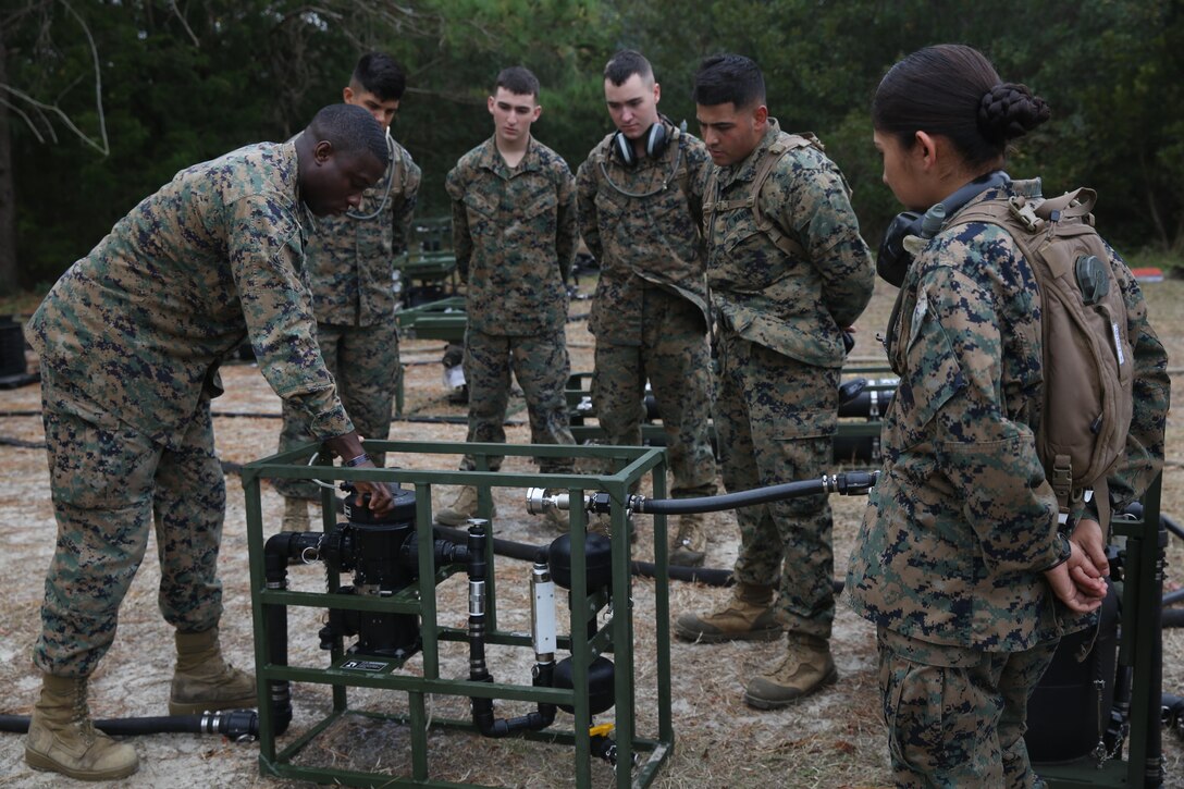 Staff Sgt. Sheldon Dias instructs Marines on how to operate the light weight water purification system at the Marine Corps Engineer School on Marine Corps Base Camp Lejeune, Nov. 29. The system can purify about two gallons of water per minute. Dias is an instructor at Marine Corps Engineer School.