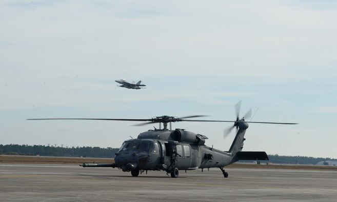 A U.S. Air Force 66th Rescue Squadron HH-60G Pave Hawk taxies into Tyndall Air Force Base, Fla., during exercise Checkered Flag, Dec. 8, 2016. The mission of the 66th RQS is to provide rapidly deployable, expeditionary, and agile combat search and rescue forces to battlefield theaters in response to contingency operations worldwide. (U.S. Air Force photo by Airman 1sy Class Cody R. Miller/Released)