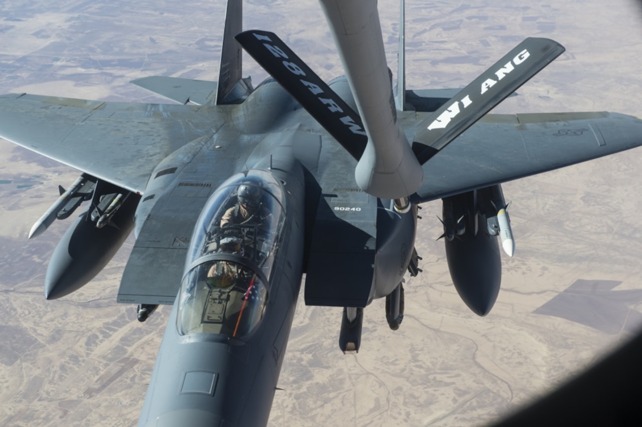 A U.S. Air Force F-15E Strike Eagle approaches a KC-135 Stratotanker in support of a Combined Joint Task Force Operation Inherent Resolve mission over Iraq, Dec. 7, 2016. The KC-135 provides aerial refueling capabilities as the task force supports the Iraqi security forces and the partnered forces in Syria as they work to liberate territory and people under the control of the Islamic State of Iraq and the Levant. Air Force photo by Staff Sgt. Matthew B. Fredericks