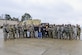 UFC fighters Ben Rothwell, Valentina Shevchenko, and Lorenz Larkin pose for a photo with U.S. Army Soldiers from the 7th Transportation Brigade (Expeditionary) at Joint Base Langley-Eustis, Va., Dec. 8, 2016. The fighters met with the Soldiers to discuss their daily operations and to thank them for their dedication. (U.S. Air Force photo by Tech. Sgt. Katie Gar Ward)