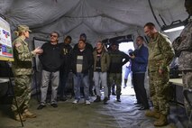 UFC fighters Ben Rothwell, Valentina Shevchenko, and Lorenz Larkin meet with U.S. Army Soldiers from the 690th Rapid Port Opening Element at Joint Base Langley-Eustis, Va., Dec. 8, 2016. During the visit, the Soldiers demonstrated their rapid deployment capabilities and took the fighters on a convoy. (U.S. Air Force photo by Tech. Sgt. Katie Gar Ward)