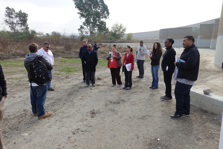 The District’s Regulatory Environmental Engineer Gerry Salas (second from the left), and Biologist Steve Estes (far left), led the group’s dam basin tour.  Estes explained the habitat surrounding the dam and the various species that call the basin home. Estes and Salas share a responsibility to safeguard the environment around the dam while balancing the needs of the community. LA Unified School District and STEM Academy educators and administrators took a field trip to the Whittier Narrows Dam on Dec. 6.  U.S. Army Corps of Engineer Los Angeles District, which operates and maintains the dam, promotes STEM by hosting visits to their sites.