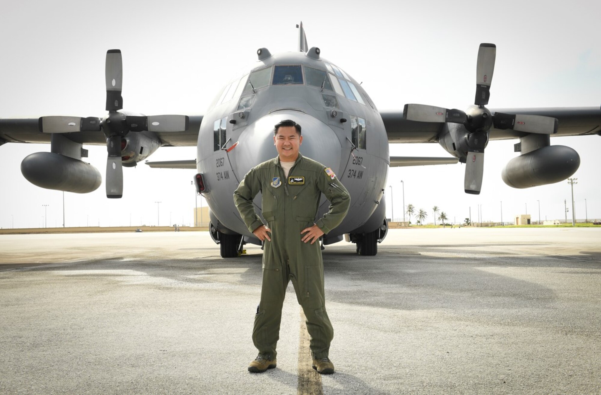 Staff Sgt. Thelmo Andre Garrucho, 36th airlift squadron C-130 H flight engineer, stands in front of a C-130 H during Operation Christmas Drop at Anderson Air Force Base, Guam, 16 Dec., 2016. Since its inception, the C-130H cockpit crew has consisted of four members: pilot, copilot, navigator and flight engineer. With technological advances and the release of the C-130’s newest iteration, the C-130 J, that classic combination is changing. Automated functions have taken over the roles of the flight engineer and the navigator on the J-model. 