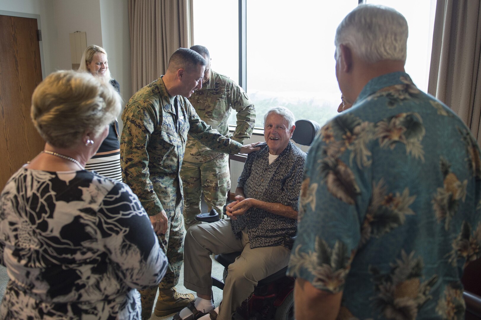 161208-N-DX698-014 CAMP H.M. SMITH, Hawaii (Dec. 8, 2016) U.S. Pacific Command, Senior Enlisted Leader, Sgt. Maj. Anthony A. Spadaro, center left, greets WWII and former POW veteran, Sgt. George Emerson and his wife during their visit to the PACOM headquarters. Emerson was invited on behalf of PACOM commander Adm. Harry Harris after he was unable to attend the official 75th Anniversary Commemoration on Dec. 7th in Pearl Harbor. Emerson served in the U.S. Army Air Corps and was captured by German forces when his plane was destroyed during an attack.  (U.S. Navy photo by Petty Officer 1st Class Jay M. Chu/Released)