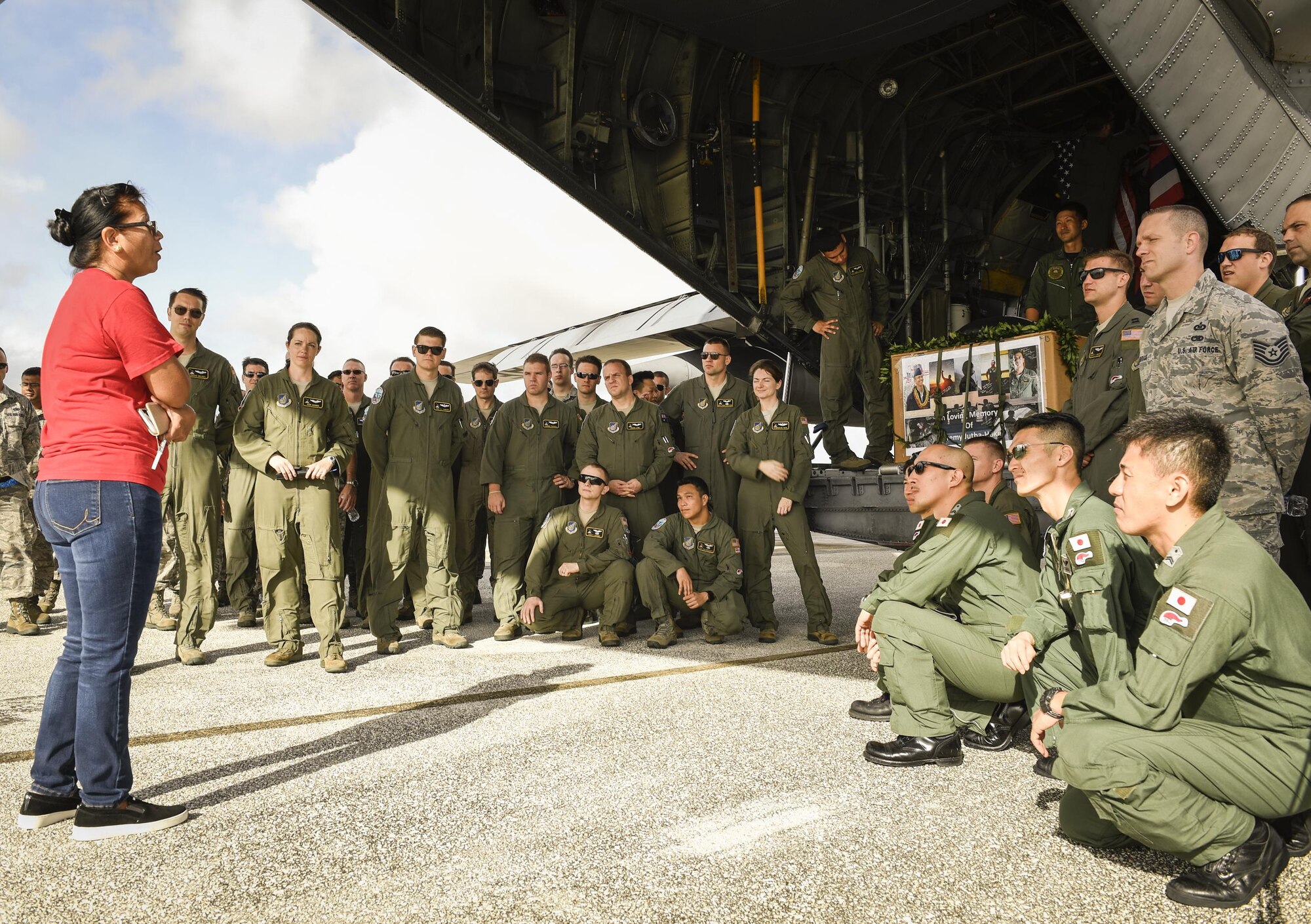 Eva Hake speaks to fellow Airmen and friends of her late son, Senior Airman Jeremy Jutba-Hake, 36th Airlift Squadron instructor loadmaster, during his remembrance ceremony at Andersen Air Force Base, Guam, Dec. 6, 2016. Jutba-Hake collapsed during post-flight duties following a training mission during Operation Christmas Drop 2015. On day two of OCD 2016, Jutba-Hake’s colleagues, friends and family gathered for a remembrance ceremony before beginning the day’s mission. (U.S. Air Force photo by Senior Airman Elizabeth Baker/Released)