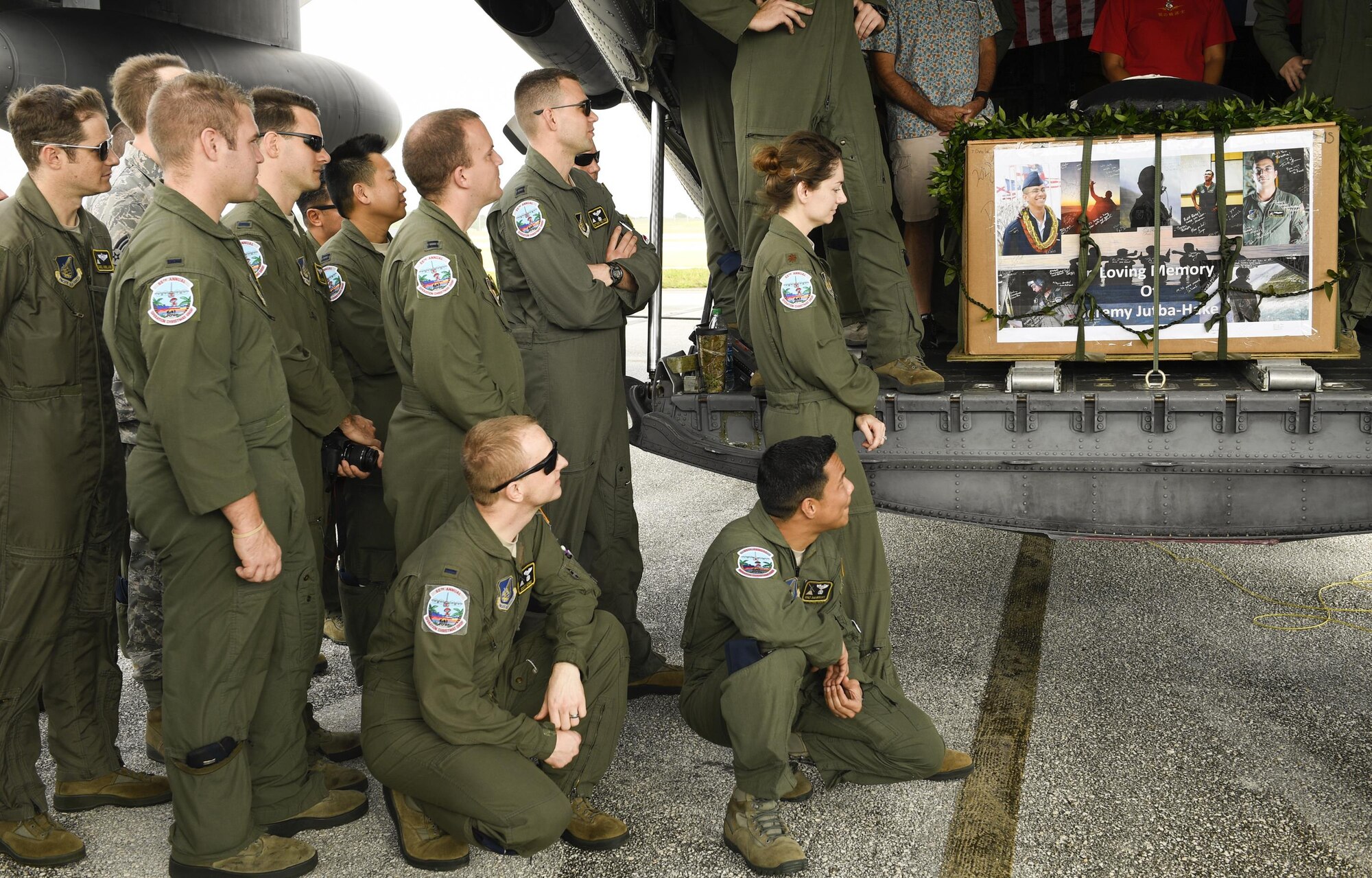 Fellow Airmen of the late Senior Airman Jeremy Jutba-Hake, 36th Airlift Squadron instructor loadmaster, attend his remembrance ceremony at Andersen Air Force Base, Guam, Dec. 6, 2016. Jutba-Hake collapsed during post-flight duties following a training mission during Operation Christmas Drop 2015. On day two of OCD 2016, participants gathered for a remembrance ceremony before beginning the day’s mission. (U.S. Air Force photo by Senior Airman Elizabeth Baker/Released)