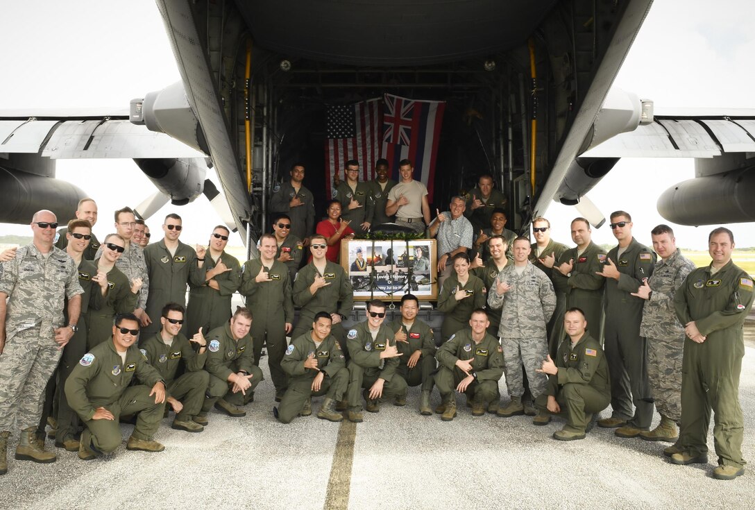 Colleagues, friends and family of the late Senior Airman Jeremy Jutba-Hake, 36th Airlift Squadron instructor loadmaster, gather for his remembrance ceremony at Andersen Air Force Base, Guam, Dec. 6, 2016. Jutba-Hake collapsed during post-flight duties following a training mission during Operation Christmas Drop 2015. On day two of OCD 2016, participants took time to remember him before beginning the day’s mission. (U.S. Air Force photo by Senior Airman Elizabeth Baker/Released)
