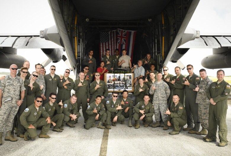 Colleagues, friends and family of the late Senior Airman Jeremy Jutba-Hake, 36th Airlift Squadron instructor loadmaster, gather for his remembrance ceremony at Andersen Air Force Base, Guam, Dec. 6, 2016. Jutba-Hake collapsed during post-flight duties following a training mission during Operation Christmas Drop 2015. On day two of OCD 2016, participants took time to remember him before beginning the day’s mission. (U.S. Air Force photo by Senior Airman Elizabeth Baker/Released)