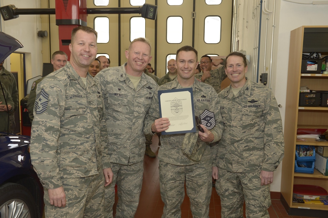 Senior Master Sgt. Andrew Slater, center right, 52nd Logistic Readiness Squadron transportation training center superintendent, receives notification he has been selected for promotion to chief master sergeant from Col. Joe McFall, center left, 52nd Fighter Wing commander, Col. Steven Horton, right, 52FW vice commander, and Chief Master Sgt. Edwin Ludwigsen, left, 52FW command chief, at Spangdahlem Air Base, Germany, Dec. 7, 2016. The selected senior master sergeant will later be inducted into the top one percent of the Air Force's enlisted ranks. (U.S. Air Force photo by Staff Sgt. Jonathan Snyder)