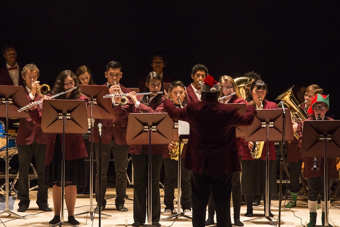 The Matthew C. Perry symphonic band plays “The Night Before Christmas” during the annual holiday celebration concert at the Sakura Assembly Hall at Marine Corps Air Station Iwakuni, Japan, Dec. 7, 2016. The concert showcased various musical groups from M.C. Perry and brought base residents, students and staff from Suo-Oshima Municipal Elementary School, Waki Junior High School and Otake Municipal Ogata Junior High School together. Guests enjoyed performances by the symphonic band, Samurai choir, concert band, M.C. Perry Voices, the Pentatonix, and the symphonic band, which featured songs such as “Angels We Have Heard on High,” Elijah Rock,” “Up on the Housetop,” and “Santa Clause is Coming To Town.” (U.S. Marine Corps photo by Cpl. Aaron Henson)