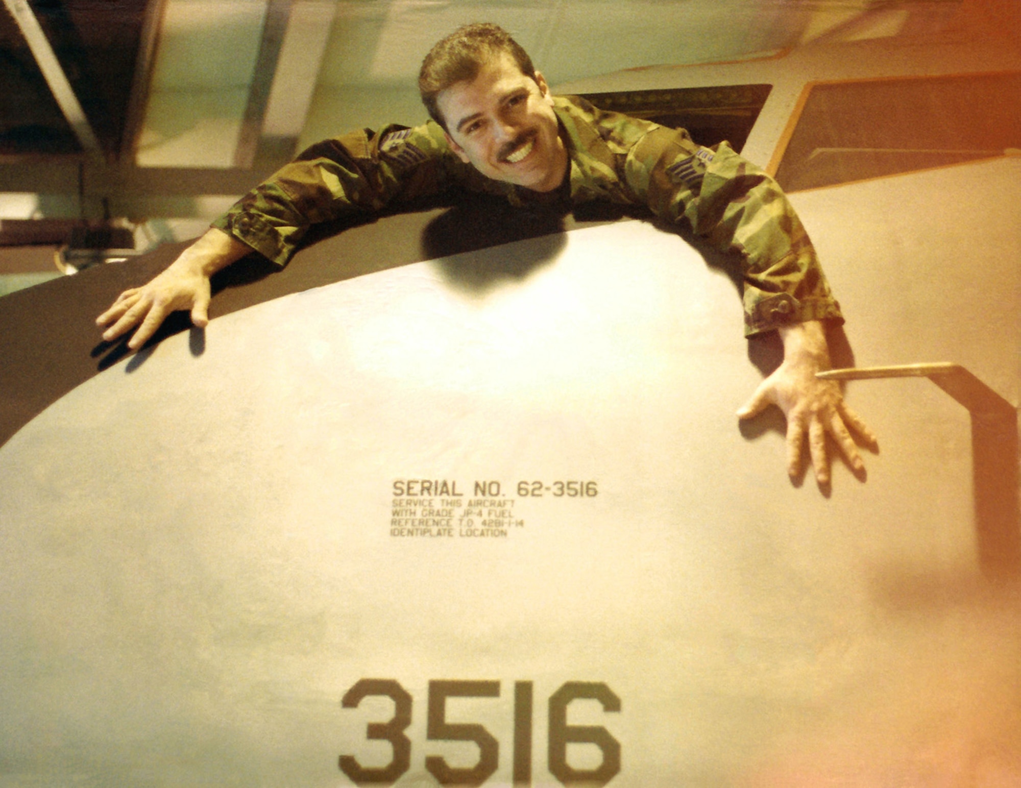 Former U.S. Air Force Staff Sgt. Dan Cinelli poses for a photo from the cockpit of a KC-135 Stratotanker in 1993 on RAF Mildenhall, England. Aircraft tail number 62-3516 was the first KC-135 he was assigned to as a crew chief when stationed at Griffiss Air Force Base, Rome, New York, when it was an “A” model. The jet was re-engined to an “R” model years later, and eventually leased to the French Air Force in the 1990s. During the time when Cinelli worked in the 100th Aircraft Maintenance Squadron isochronal inspection team, the aircraft showed up at RAF Mildenhall ready to receive a one-time isochronal inspection, and he recognized it as his old jet.  (Courtesy photo)
