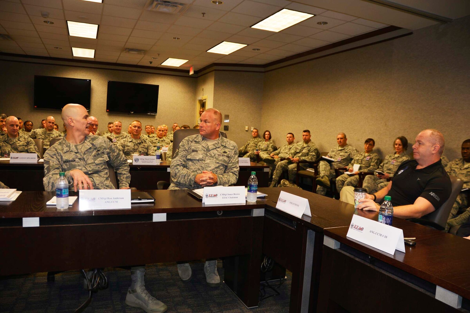 (From left) West Virginia Army National Guard Command Sergeant Maj. James Allen and Air National Guard Enlisted Force Advisory Council Chairman and Kansas National Guard Senior Enlisted Leader, Chief Master Sgt. James Brown, listen to a point by Chief Master Sgt. Richard King, Continental U.S. Aerospace Defense Region-1st Air Force (AFNORTH) Command Chief, during the Enlisted Force Advisory Council Meeting at Tyndall Air Force Base, Fla., Dec. 6-7. It was the first time a command sergeant major attended the Air National Guard EFAC event as it was determined similar issues for enlisted forces existed across both armed service brances. Brown will attend the next Army Command Sergeant Major Advisory Council meeting. (Photo by Mary McHale)