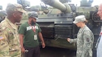 Staff Sgt. Danielle Milke does a walk-through inspection of an M1A2 Abrams tank with AMC's Chief Warrant Officer 5 Darren Cook and a contract employee, Sept. 19, 2016, in Romania. The tanks were used during a U.S. Army Europe multinational training exercise. Milke volunteered to be the NCOIC for Army Prepositioned Stocks-Romania, and is a maintenance NCO for the Army Sustainment Command-Army Reserve Element, Detachment 12 from Fort Bragg, N.C.