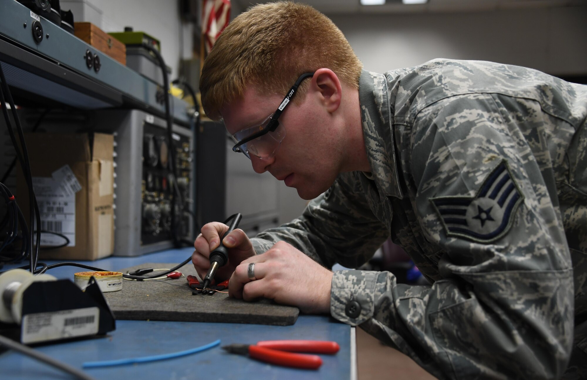 Staff Sgt. Kevin Mulhollen, aircraft electrical and environmental technician with the 911th Aircraft Maintenance Squadron, repairs a test jumper at the Pittsburgh International Airport Air Reserve Station, Dec. 4, 2016. A test jumper connects two wires to perform operational checks and troubleshooting of newly replaced or broken parts. (U.S. Air Force photo by Staff Sgt. Marjorie A. Bowlden)