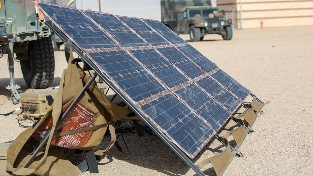 Marines with 3rd Battalion, 11th Marine Regiment, display the Ground Renewable Expeditionary Electronics Network System during the Energy Capability Exercise, in alignment with the Great Green Fleet initiative, at Camp Wilson aboard the Marine Corps Air Ground Combat Center, Twentynine Palms, California, Dec. 6, 2016. 