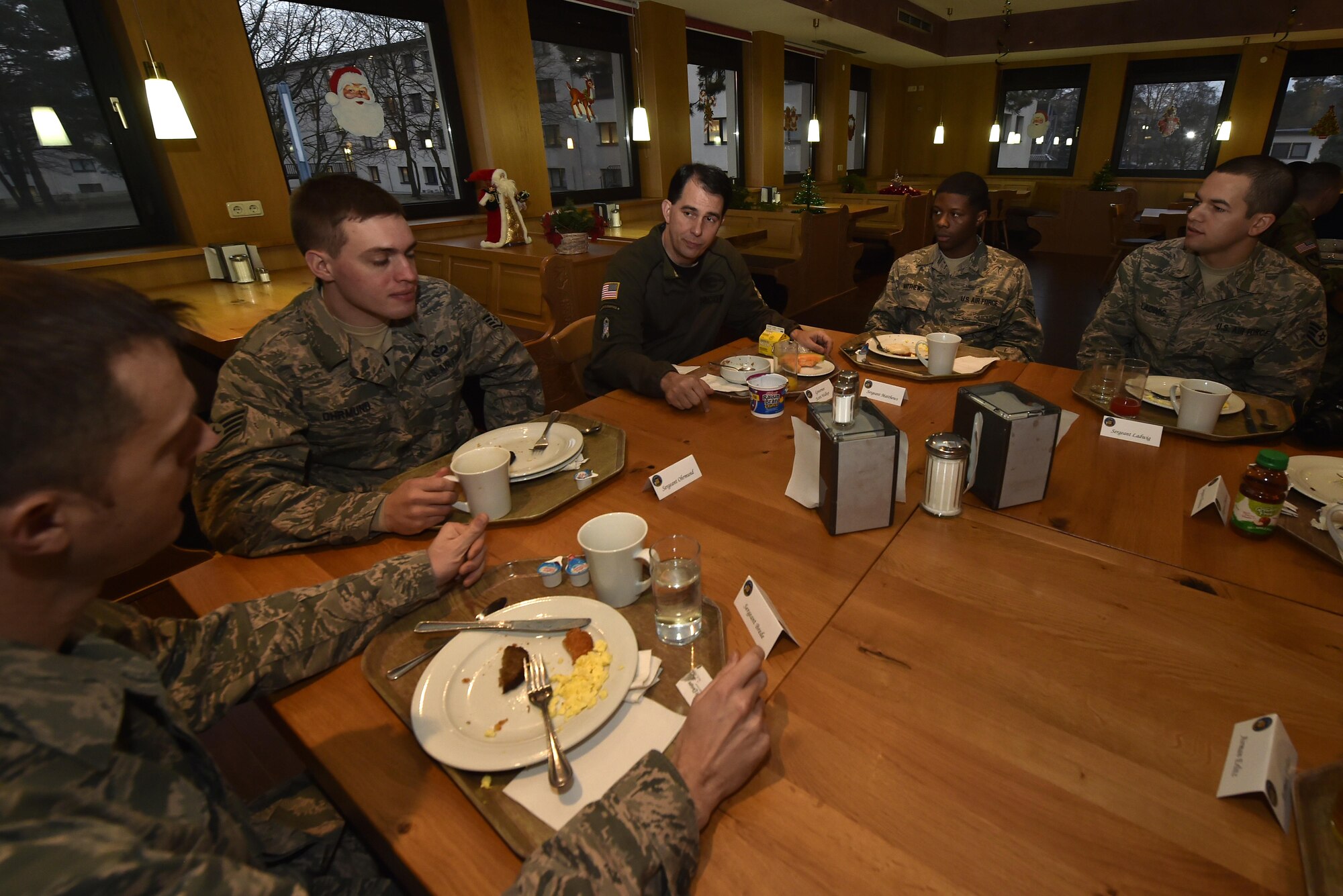 Wisconsin Governor Scott Walker enjoys a breakfast with his constituents at Ramstein Air Base Germany, Dec. 9, 2016. Walker traveled with the Oklahoma and Nevada governors to the U.S. Air Forces Central Command area of responsibility and Landstuhl Regional Medical Center, Germany. (U.S. Air Force photo by Senior Airman Jonathan Bass)