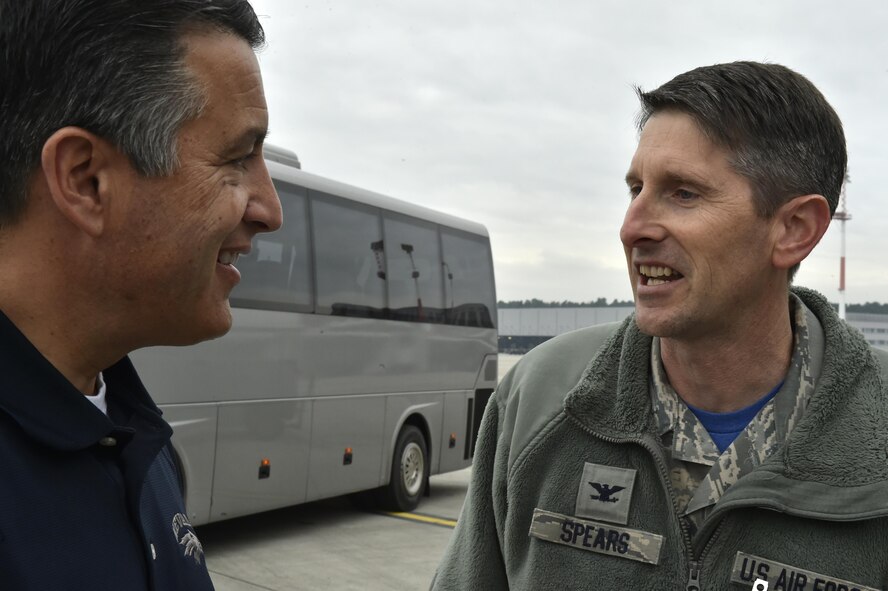 Nevada Governor Brian Sandoval, introduces himself to U.S. Air Force Col. Bradley Spears, 521st Air Mobility Operations Wing vice wing commander, at Ramstein Air Base, Germany, Dec. 9, 2016. Sandoval traveled to the U.S. Air Forces Central Command area of responsibility to visit with his constituents. After returning to Ramstein, Sandoval, along with the Oklahoma and Wisconsin governors, received a briefing about the importance of the Aeromedical Evacuation mission. (U.S. Air Force photo by Senior Airman Jonathan Bass)