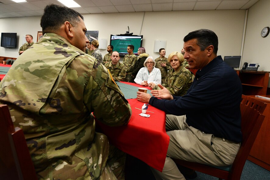 Nevada Governor Brian Sandoval meets with his constituents at Landstuhl Regional Medica Center, Germany, Dec. 9, 2016. Sandoval, along with the governors of Wisconsin and Oklahoma, traveled to the U.S. Air Forces Central Command area of responsibility to interact with his constituents and LRMC. (U.S. Air Force photo by Senior Airman Jonathan Bass)