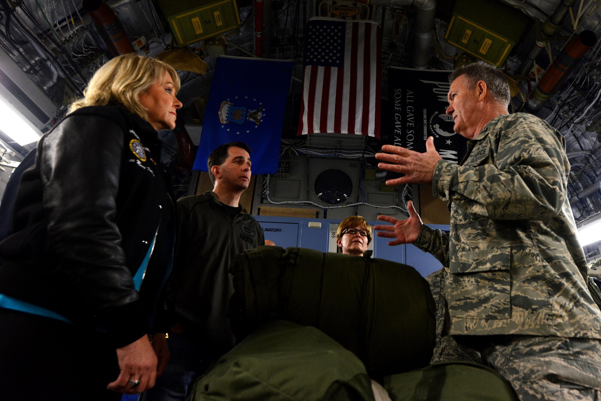 California Air National Guard Col. James Bruhl, 146th Aeromedical Evacuation Squadron commander, discusses the planning and execution of an evacuation mission with the governors of Wisconsin, Nevada, and Oklahoma, at Ramstein Air Base, Germany, Dec. 9, 2016. The governors traveled to the U.S. Air Forces Central Command area of responsibility to interact with their constituents. (U.S. Air Force photo by Senior Airman Jonathan Bass)