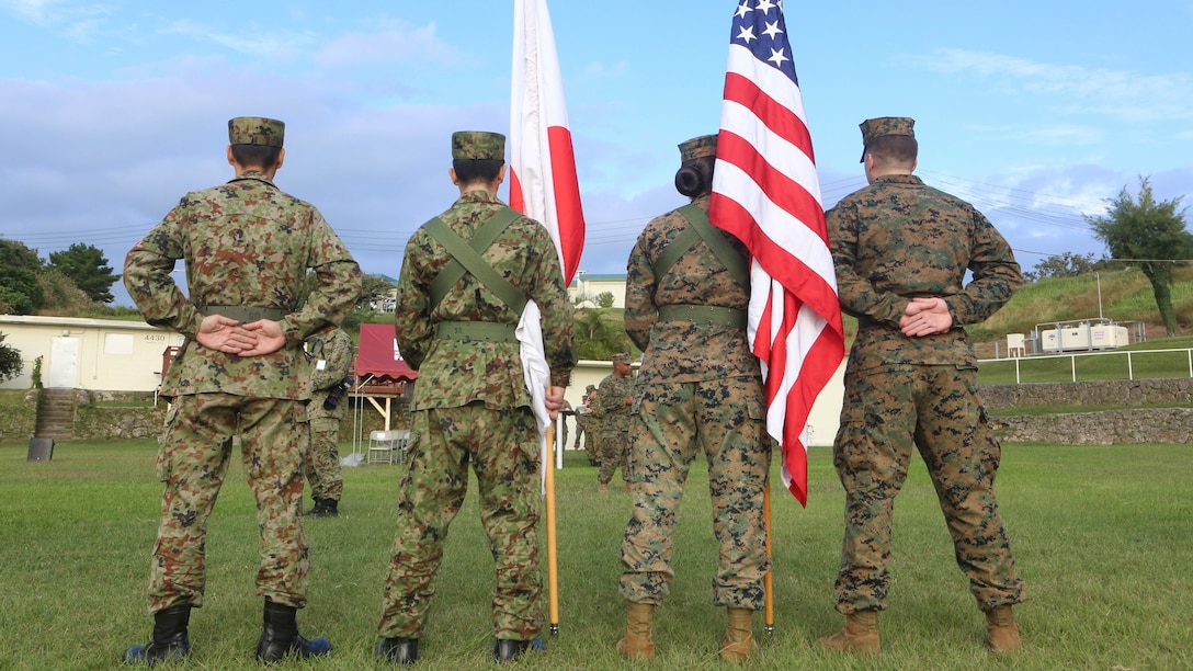 U.S. Marines with 3d Marine Expeditionary Brigade and service members of the Japan Ground Self- Defense Force prepare to perform color guard duty in Okinawa, Japan, during the opening ceremony of Yama Sakura 71, Dec. 7, 2016. The purpose of YS 71 is to both nation’s combat readiness and interoperability while strengthening bilateral relationships and demonstrating U.S. resolve to support security interests of allies and partners in the Indo-Asia-Pacific region.