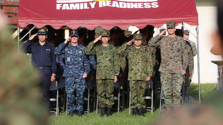 U.S. Marines with 3d Marine Expeditionary Brigade and service members of the Japan Ground Self-Defense Force salute the national colors of both nations in Okinawa, Japan, during the opening ceremony of the Yama Sakura 71 exercise, Dec. 7, 2016. Yama Sakura 71 is an annual, bilateral exercise with the JGSDF and the U.S. military. During this exercise, U.S. service members and JGSDF service members exchange ideas, tactics, techniques, military experiences, and culture.