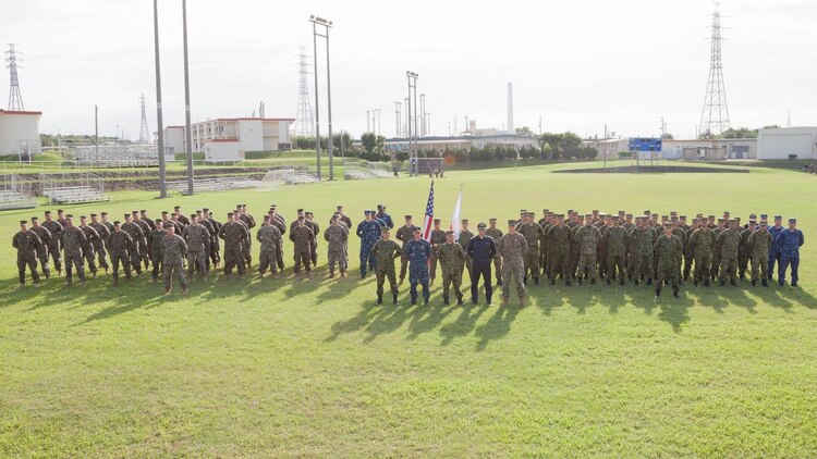 U.S. Marines with 3d Marine Expeditionary Brigade and service members of the Japan Ground Self-Defense Force conduct the opening ceremony for Yama Sakura 71 in Okinawa, Japan, Dec. 7, 2016. During this annual, bilateral exercise, members of the JGSDF and U.S. military exchange ideas, tactics, techniques, experiences, and culture. Specific Japanese units involved in YS 71 include the JGSDF Western Army, the Amphibious Ready Deployment Brigade and the Japan Maritime Self-Defense Force Mine Warfare Force. Other U.S. units include the Navy's 7th Fleet; Commander, Task Force 76; and CTF 79. 