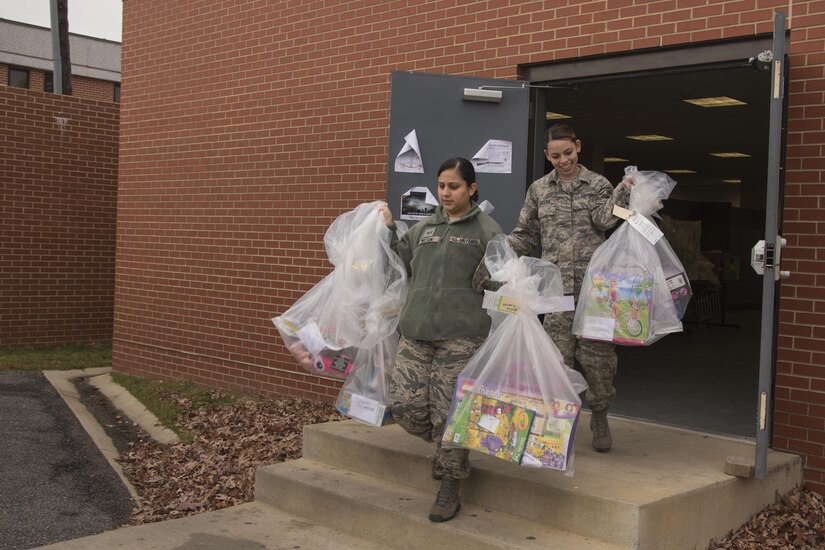 Members of the 779th Medical Group help donate gifts to the Salvation Army Angel Tree Program on Joint Base Andrews, Md., Dec. 8, 2016. Two hundred and fifty presents were donated by base members through the program for children during holidays.  (U.S. Air Force photo by Airman 1st Class Valentina Lopez)