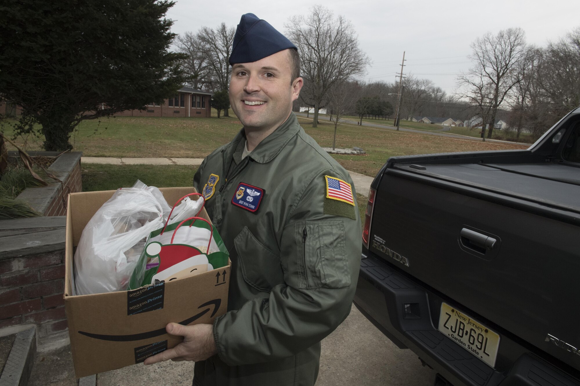 Master Sgt. Ryan Stark, 423rd Mobility Training Squadron mobility operations section chief,  delivers cookies donated from students at nearby schools to the cookie drive at Joint Base McGuire-Dix-Lakehurst, New Jersey, Dec. 8, 2016. The donated cookies were delivered to the dormitories of junior enlisted service members across the Joint Base. 
