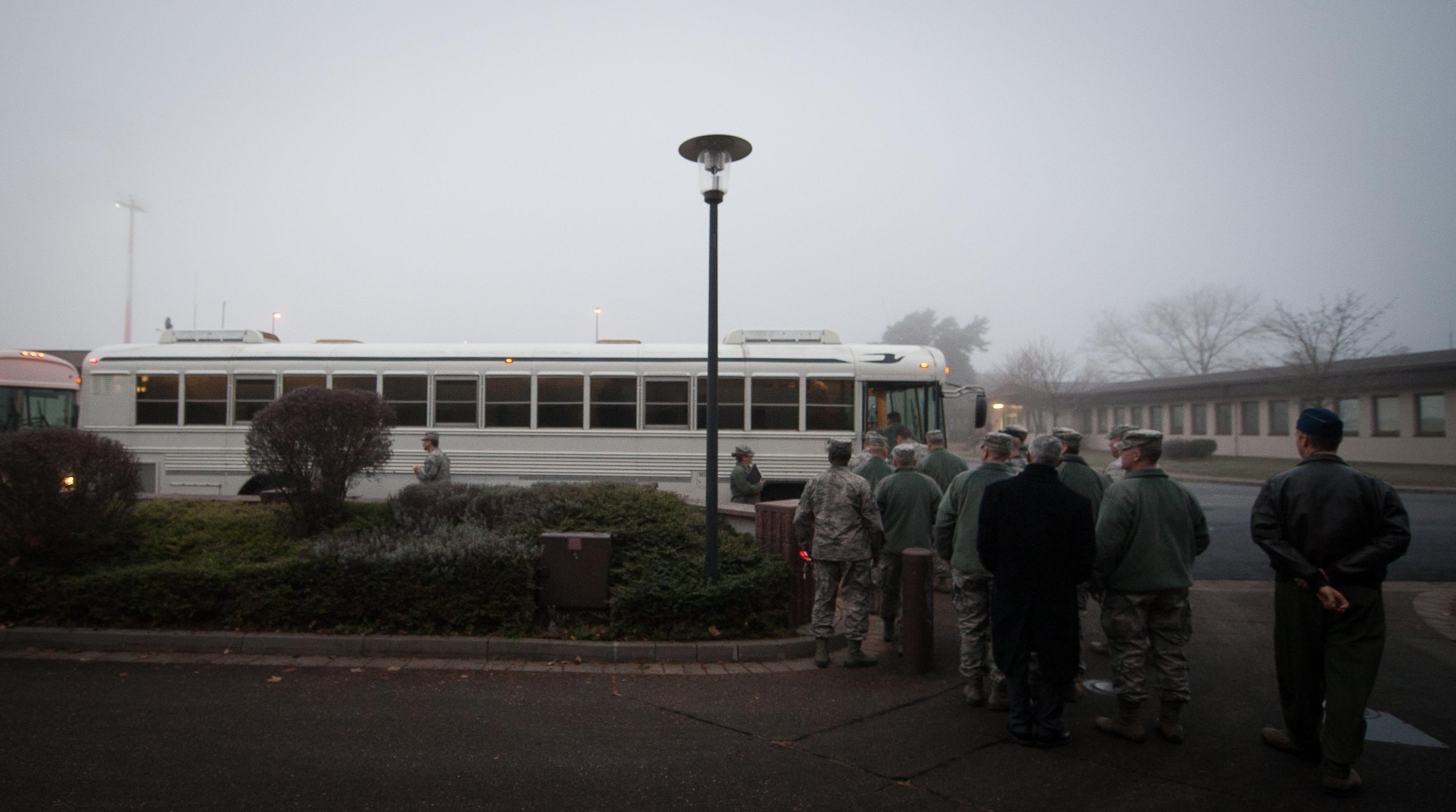 Senior leadership across the Kaiserslautern Military Community, load up on a bus before they visit Airmen selected to promote to chief master sergeant at Ramstein Air Base, Germany, Dec. 8, 2016. Although the Air Force has been an independent service since 1947, the rank of chief master sergeant did not exist until the authorization of the Military Pay Act of 1958. (U.S. Air Force photo by Airman 1st Class Lane T. Plummer)