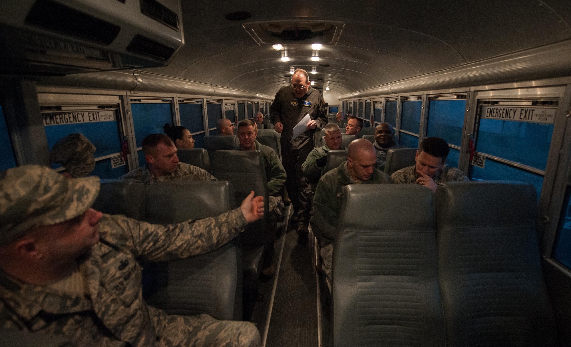 Brig. Gen. Richard G. Moore Jr., 86th Airlift Wing commander, takes accountability on a bus before he, and other senior leaders across the Kaiserslautern Military Community visit Airmen selected to promote to chief master sergeant at Ramstein Air Base, Germany, Dec. 8, 2016. According to Air Force Instruction 36-2618, all chief master sergeants are expected to serve as mentors for non-commissioned officers and junior enlisted members, and to serve as advisers to unit commanders and senior officers. (U.S. Air Force photo by Airman 1st Class Lane T. Plummer)