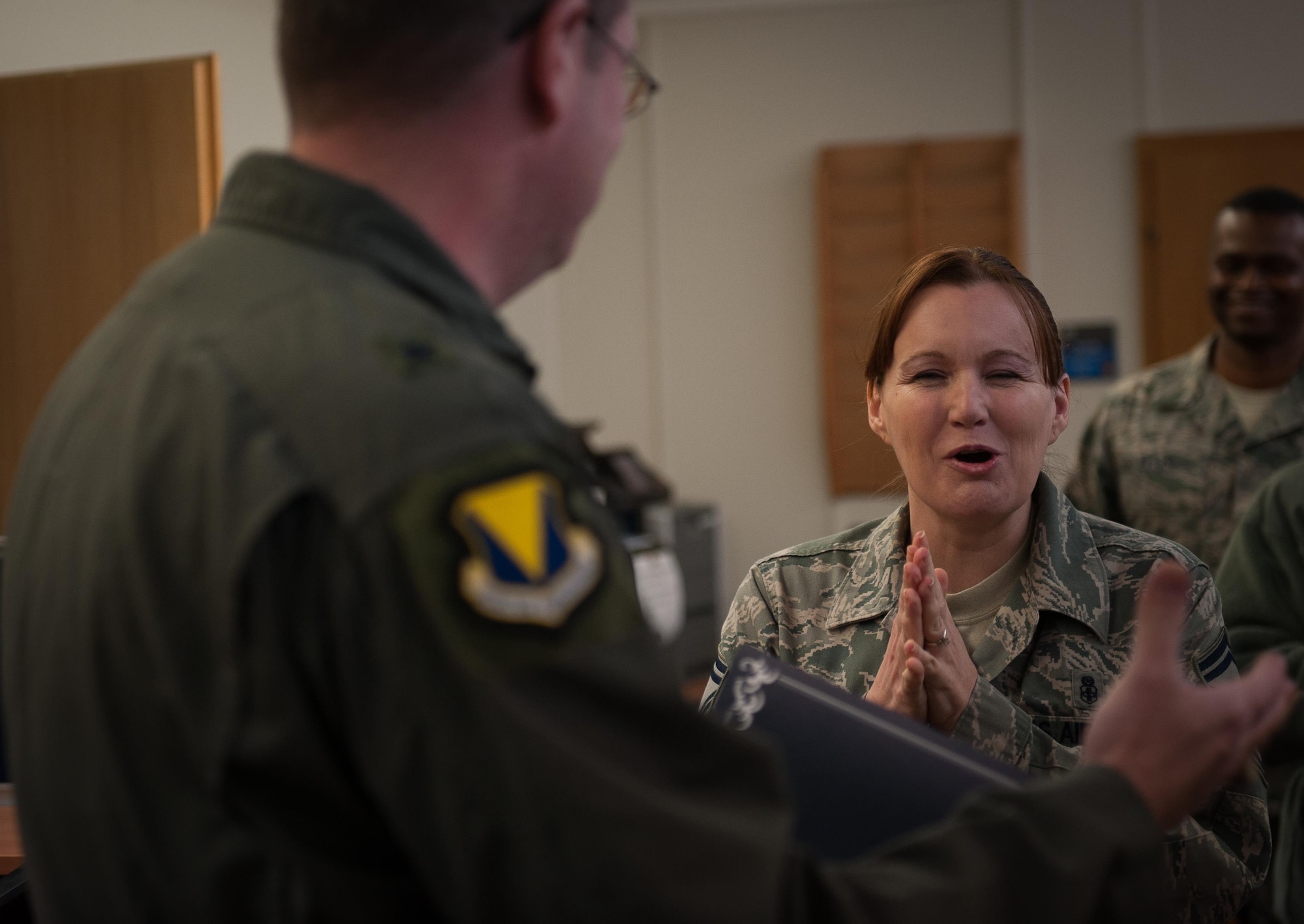 Senior Master Sgt. Susan Hale, 86th Medical Squadron command support section operations superintendent, reacts ecstatically after being notified of her promotion to chief master sergeant at Landstuhl Regional Medical Facility, Germany, Dec. 8, 2016. By congressional mandate, one percent of the Air Force enlisted corps may hold the rank of chief master sergeant. (U.S. Air Force photo by Airman 1st Class Lane T. Plummer)