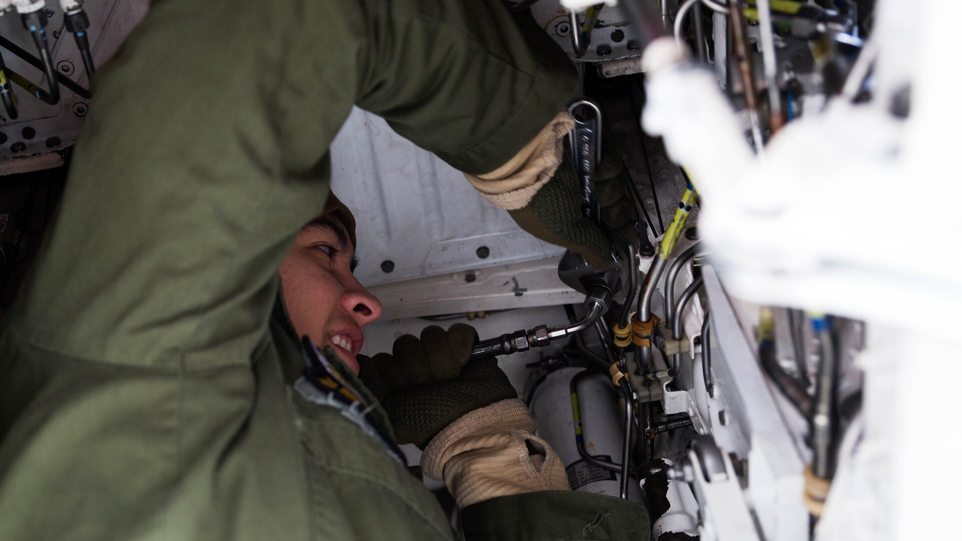 U.S. Marine Corps Lance Cpl. Anthony Dominguez, an air framer with Marine Attack Squadron 542, works on an AV-8B Harrier during the Aviation Training Relocation Program at Chitose Air Base, Japan, Dec. 7, 2016. Keeping the Harriers well maintained and ensuring the proper function of all systems is essential to supporting the ATR. 