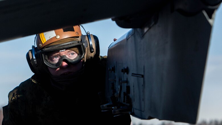 U.S. Marines with Marine Attack Squadron (VMA) 542 conduct preflight inspections during the Aviation Training Relocation Program at Chitose Air Base, Japan, Dec. 8, 2016. During the ATR the Marines with the power line division for VMA-542 have ensured the safety of all aircraft involved through routine flight inspections, launching the aircraft and recovering the aircraft. (U.S. Marine Corps photo by Cpl. James A. Guillory)