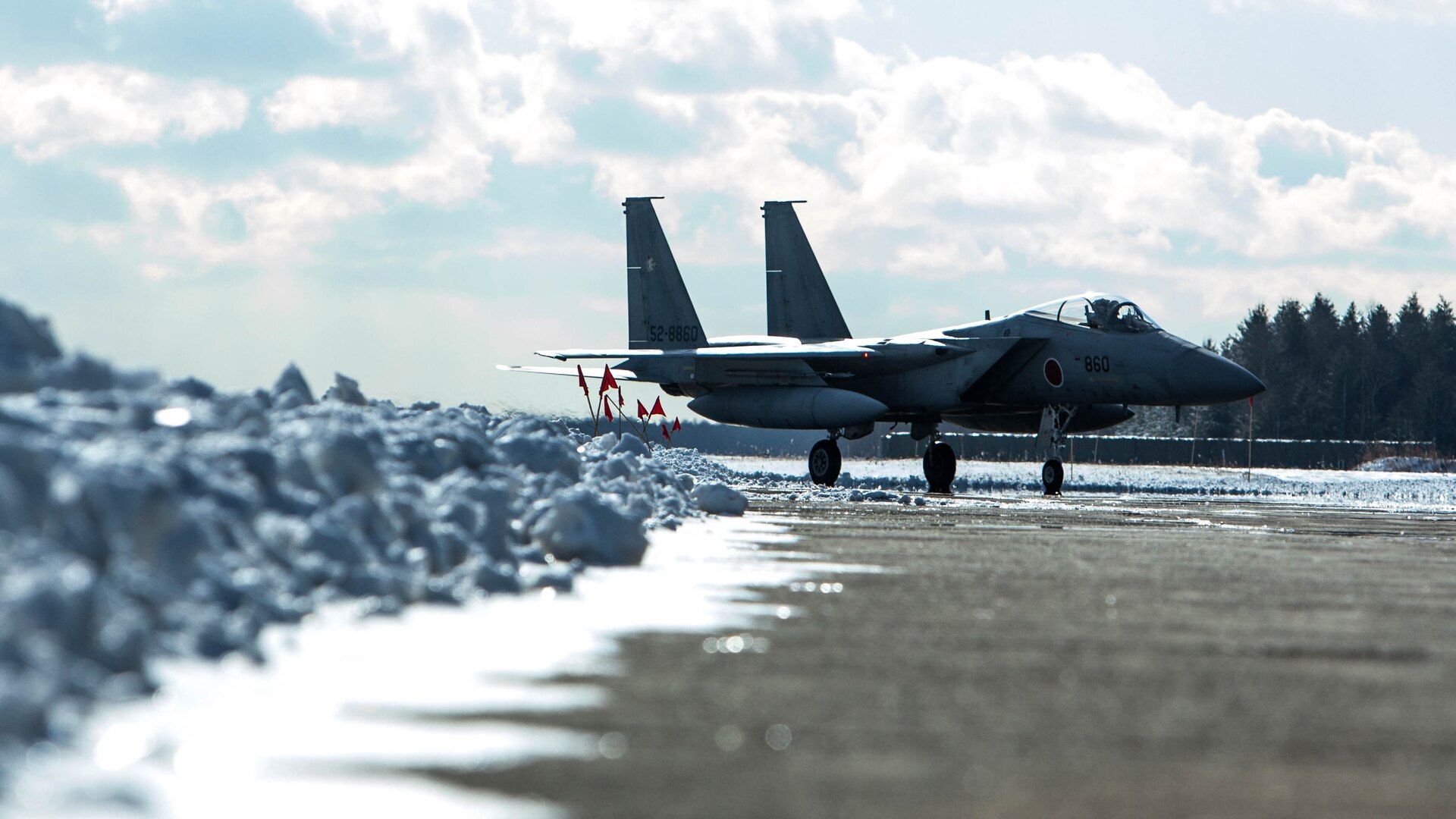 A Japan Air Self Defense Force F-15 taxis down the runway during the Aviation Training Relocation Program at Chitose Air Base, Japan, Dec. 8, 2016. The ATR is an effort to increase operational readiness between the U.S. Marine Corps and the Japan Air Self Defense Force, improve interoperability and reduce noise concerns of aviation training on local communities by disseminating training locations throughout Japan. (U.S. Marine Corps photo by Lance Cpl. Joseph Abrego)